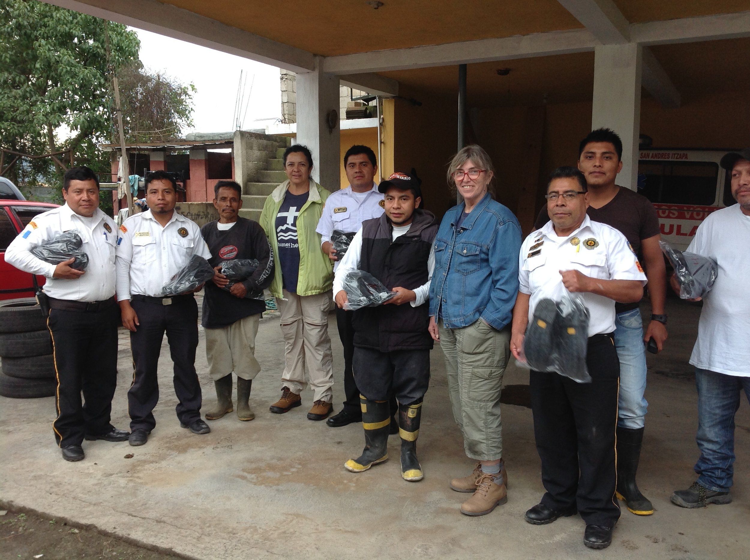 Some of the firemen and volunteers at San Andres Itzapa with new boots.jpg