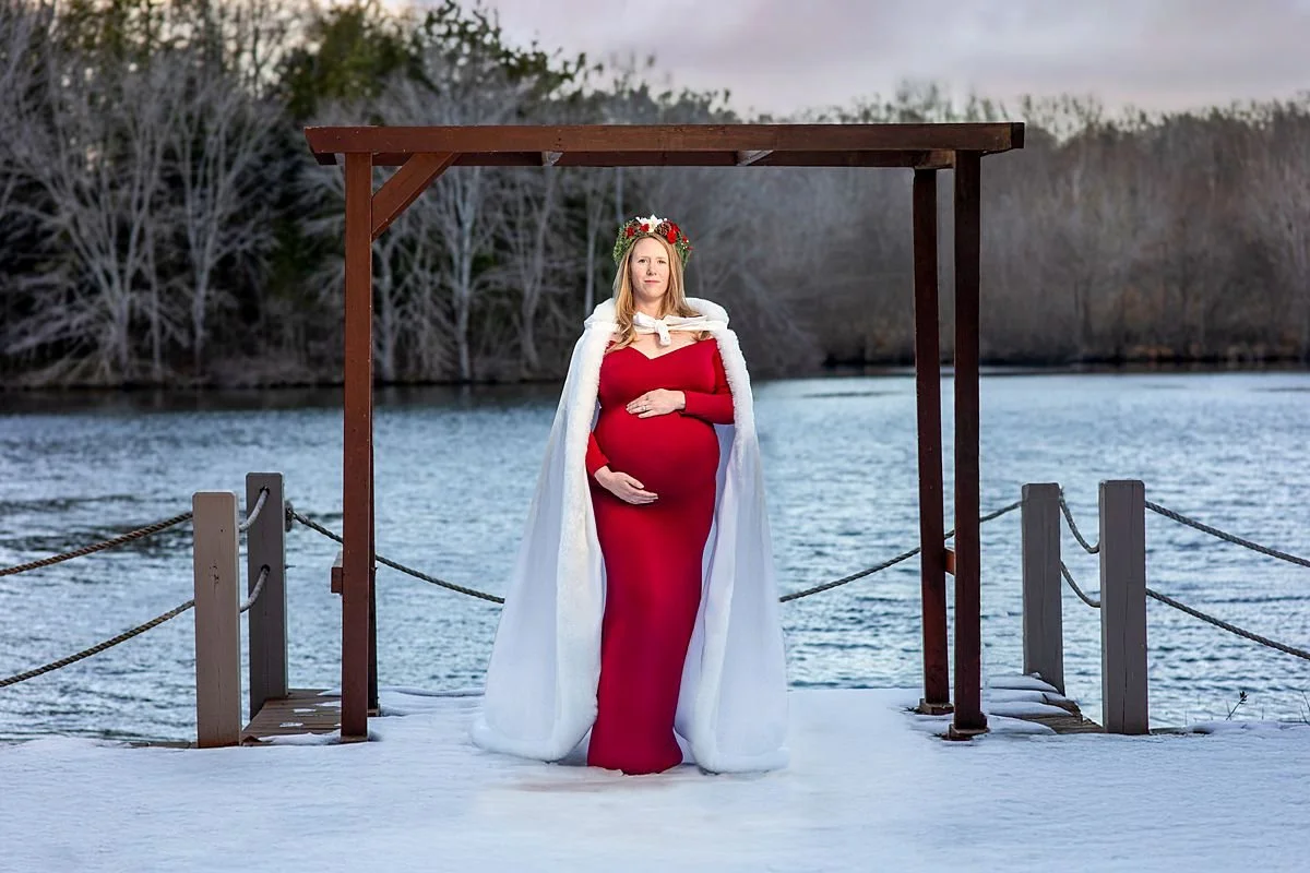 Outdoor Winter Maternity Session, Powhatan VA, Pregnant Woman in a Red Gown and White Cloak by a Snowy Lake