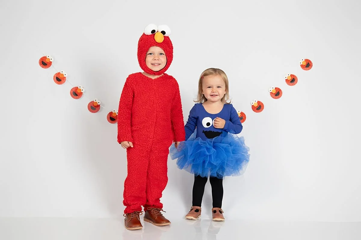 Two young children in Halloween costumes during a studio portrait session in Chesterfield VA
