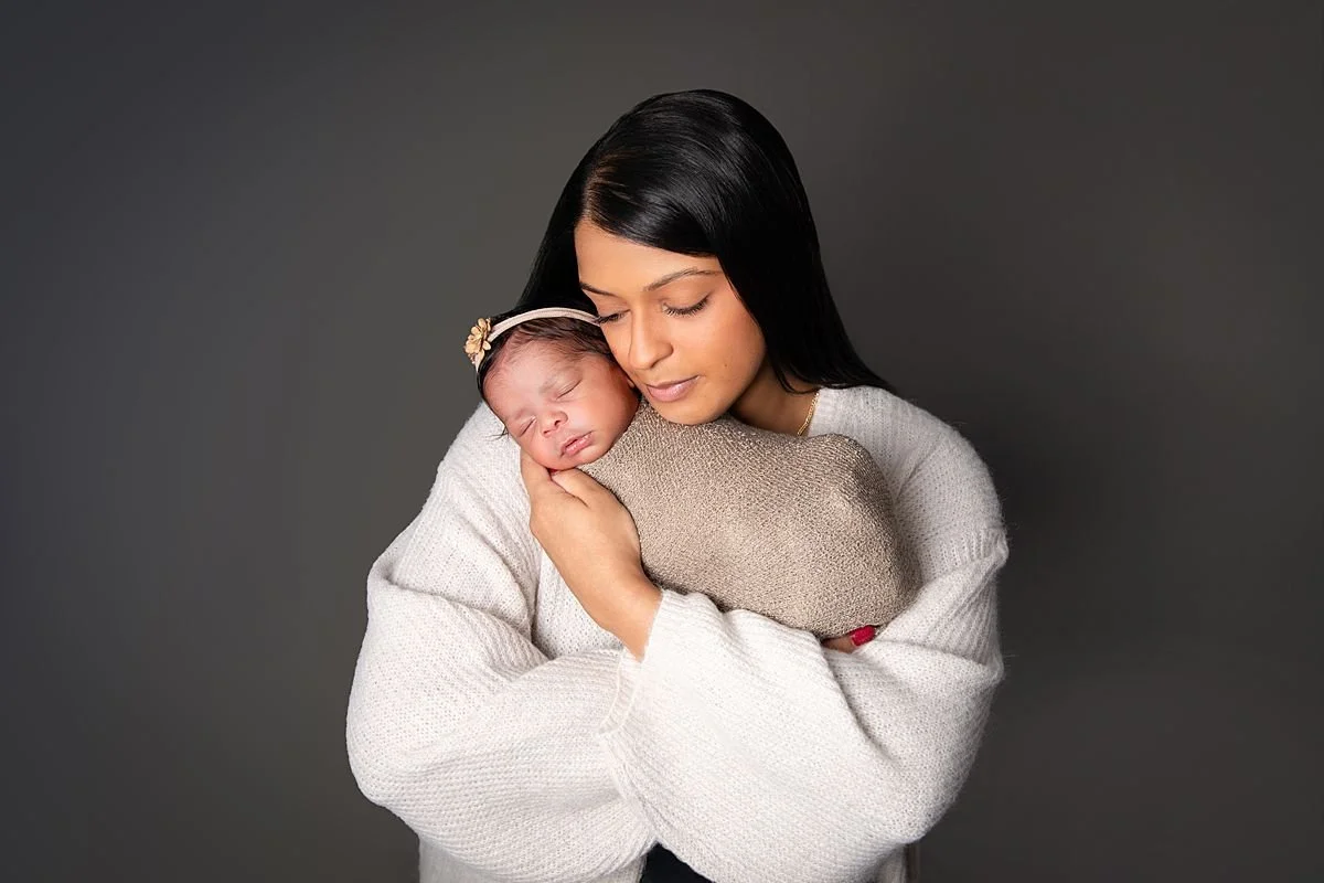 Mom cheek to cheek with sleeping newborn,  Sarah Kane Photography