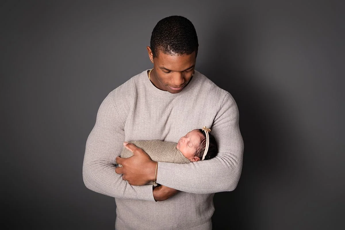 Father holding swaddled newborn twin, Sarah Kane Photography, Richmond Virginia
