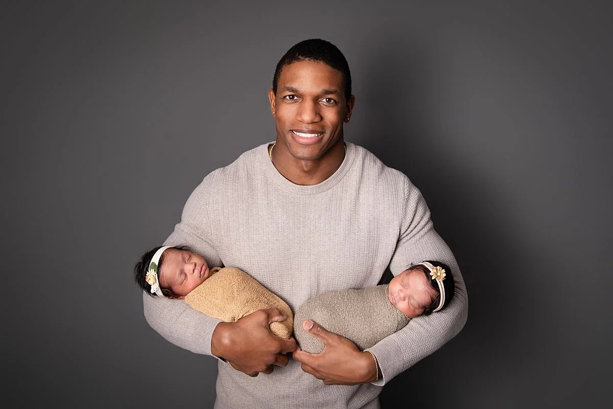 Dad holding both newborn twins, Sarah Kane Photography