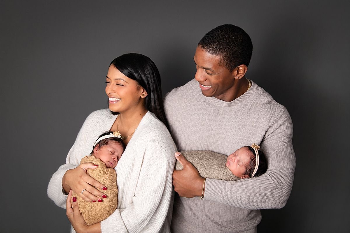 Joyful parents with newborn twins,  Sarah Kane Photography