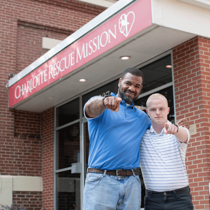 two-people-pointing-at-camera.png