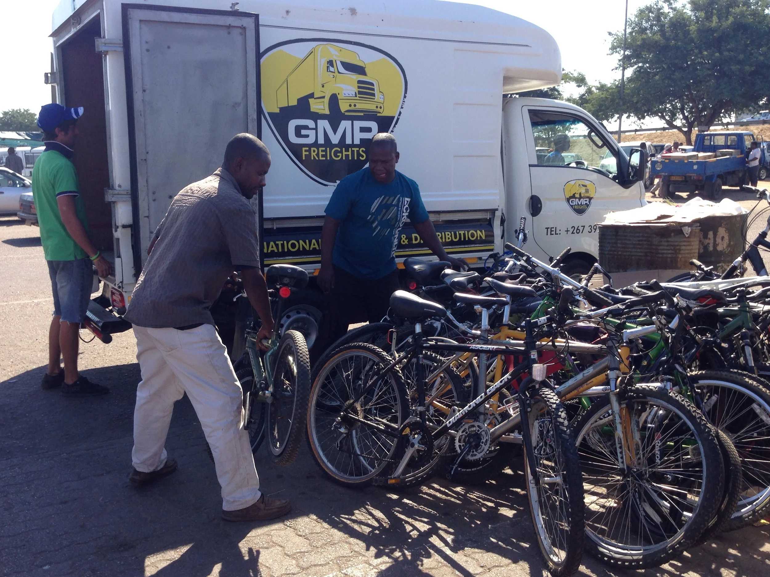 Loading bikes into the GMR truck to bring to the bus station.