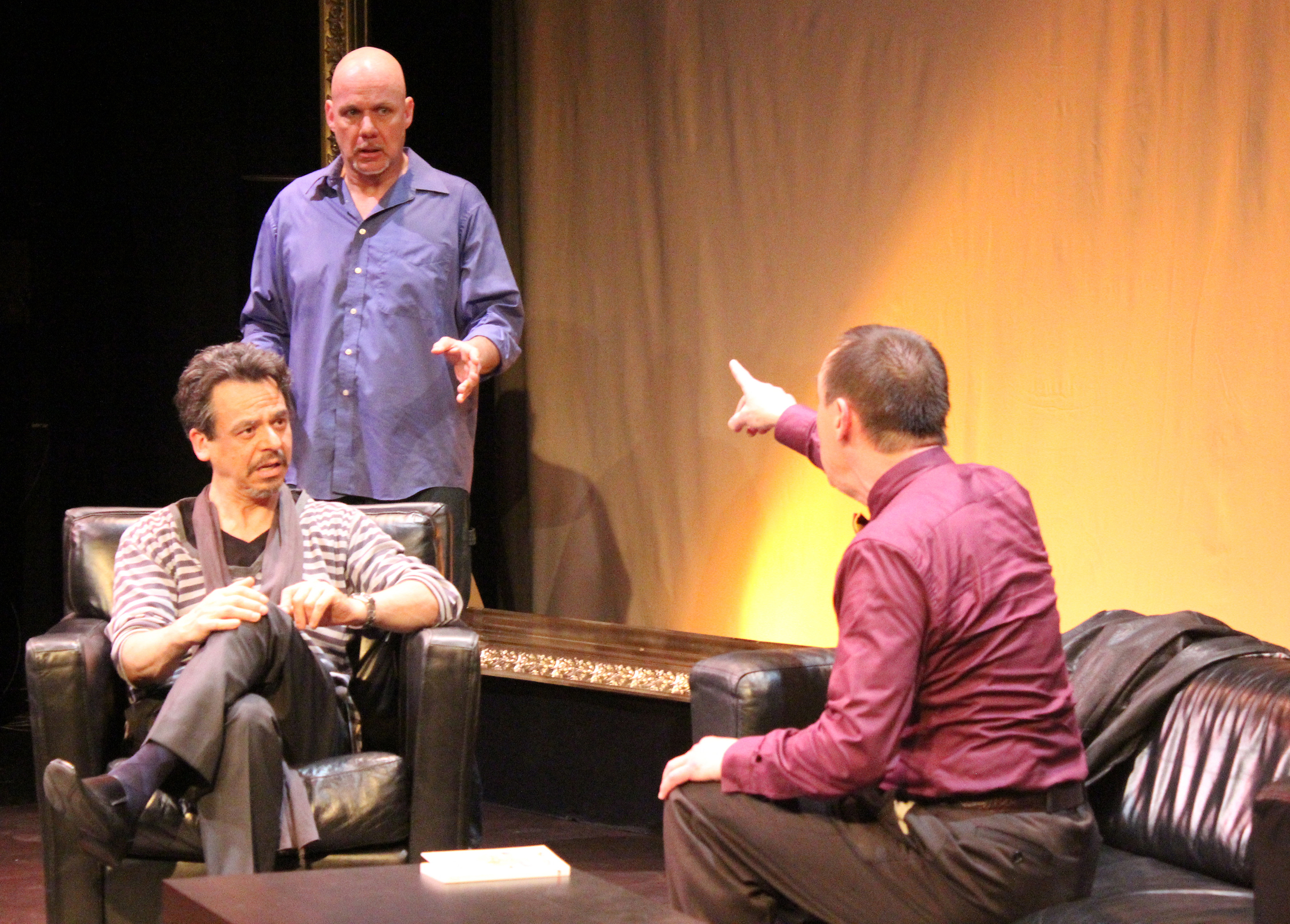 Marc (David Frisch, left) and Yvan (Andy Massingham) take a point from Serge (Robert Marinier) in 'Art' Photography by Julie Le Gal
