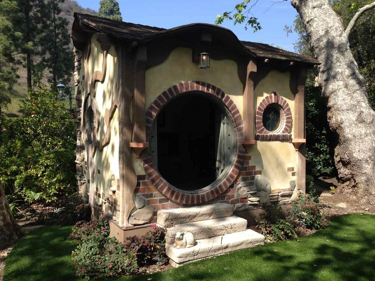 No, this isn't the Sands' house. This crazy beautiful dollhouse has a mini kitchen, fireplace, running water, and electricity. The cabinet work looks like it was made by a master craftsman and the tile work is amazing. I heard they couldn't decide on which one of the dollhouses to order, so naturally, they took both. Or was it three?