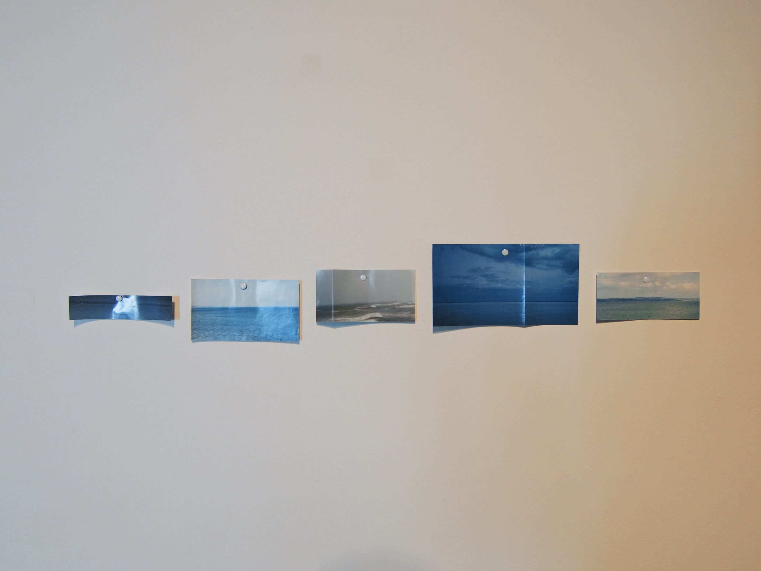  Pinned cut out National Geographic images of horizons, 20x6 inches, 2014. 