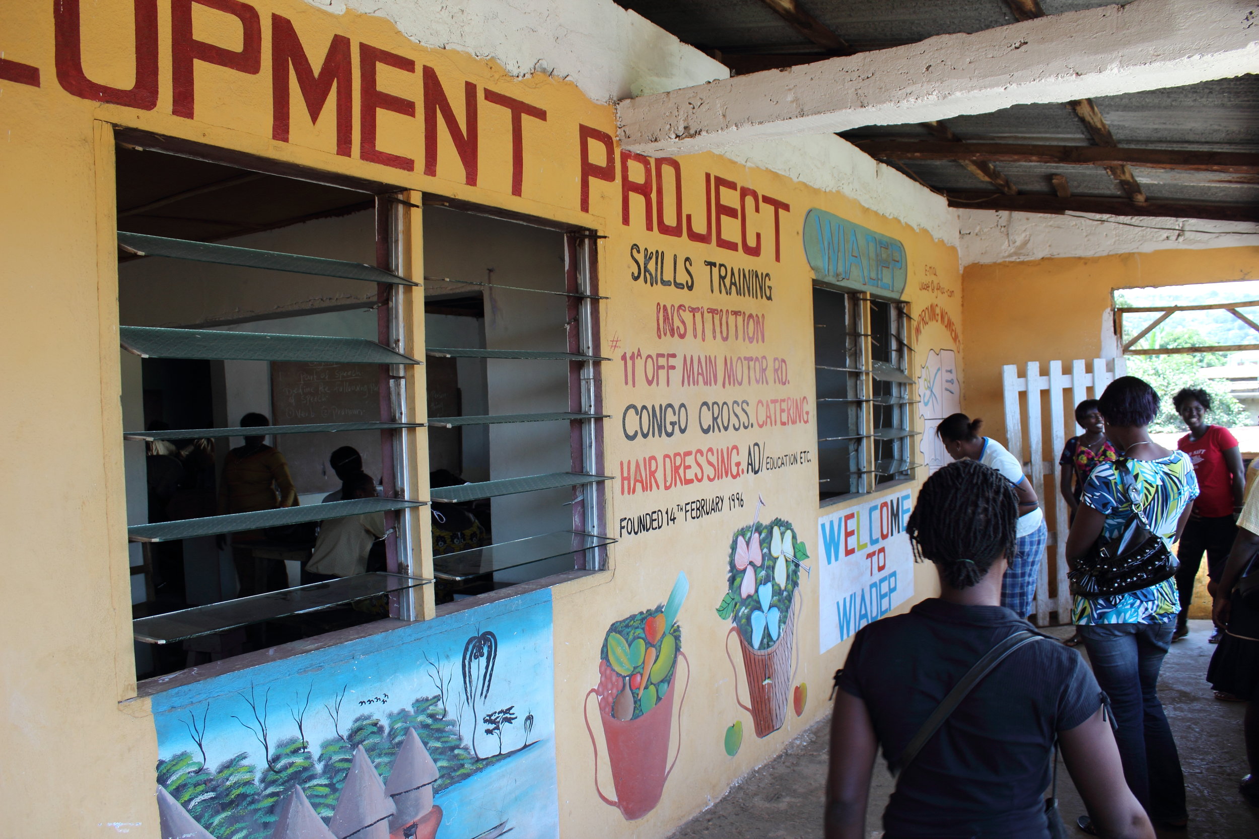 Outside of previous Women in Action building with Feb 14th Founding Date
