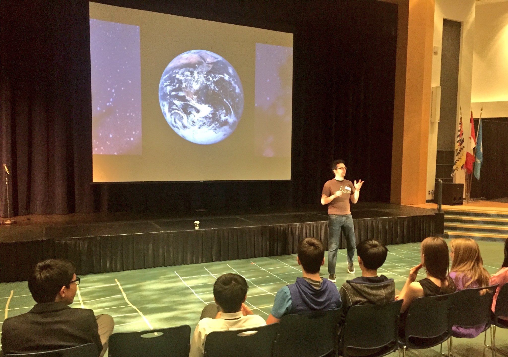 Matt Speaking at Action for Esther...Africa from Space in the background
