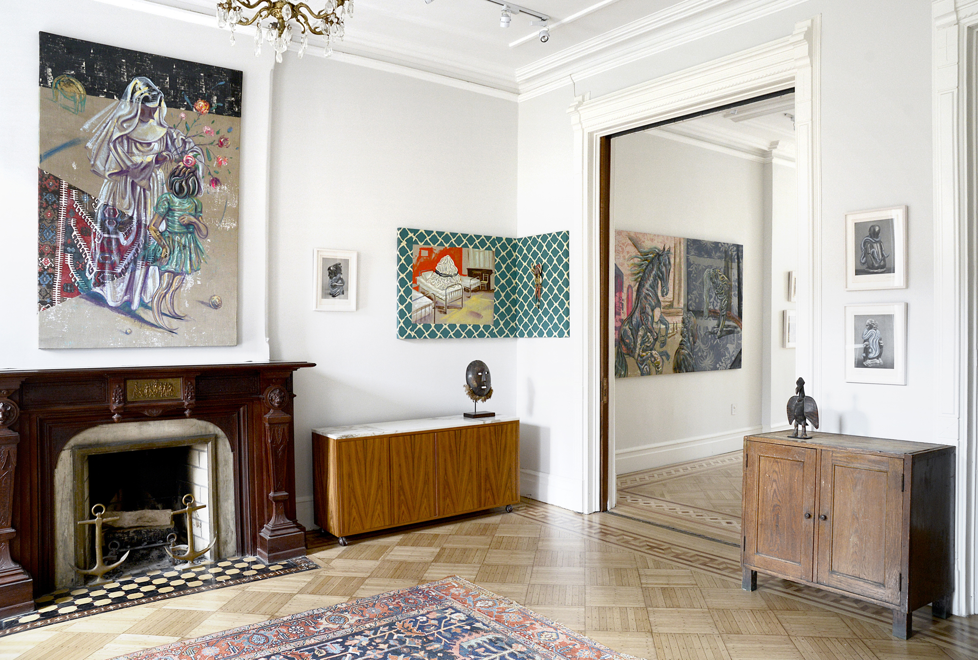 From left : Prosthetic God , 2016, oil on raw linen and sewn fabric 174 x 111 cm; Tribalphilia II, 2016, oil on book plate, 42 x 32 cm; S weet Sleeping Draughts , 2016, oil on raw linen and sewn fabric, 129.5 x 79 cm; Ituri mask, Zaire, Northeast Democratic Republic of Congo, 20th century, wood, 30.5 X 25 x 12.5 cm; The Choleric Bell Barks at Noon , 2016, oil on raw linen and sewn textile, 218.5 x 137 cm; Small Bird Figure, Senufo, Ivory Coast, Mali and Burkino Faso, West Africa,Ex-Arman collection, 1973, Early 20th century, wood, natural pigments 32 X 18 x 10 cm; Tribalphilia I, 2016, oil on book plate, 42 x 32 cm; Tribalphilia VI, 2016, oil on book plate, 42 x 32 cm photo credit: Victor Garzon