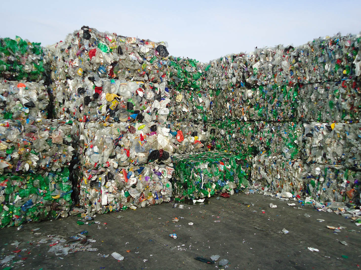 Bales of post-consumer plastic sorted for recycling.