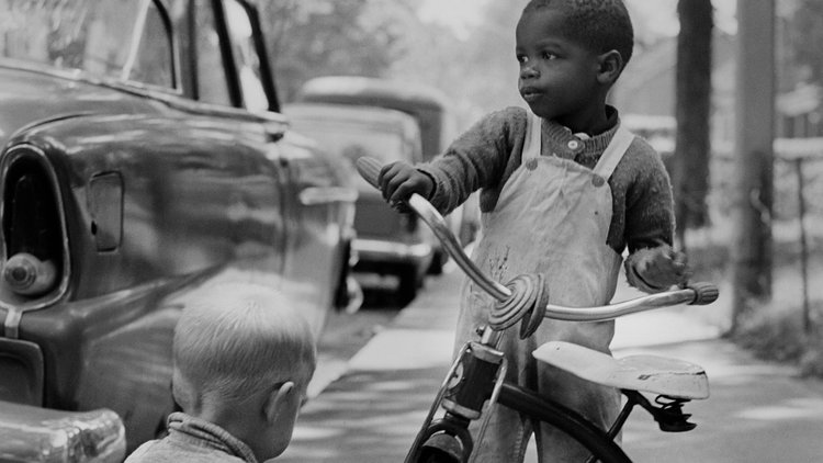 Photo taken by Toronto-based Joan Latchford in 1961 of a boy on a bicycle.