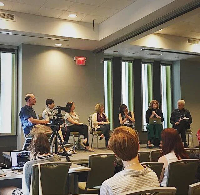 haley nelson speaking on the 2018 bly recipient panel surrounded by co-recipients, brian quirt (artistic director of nightswimming) and mark bly