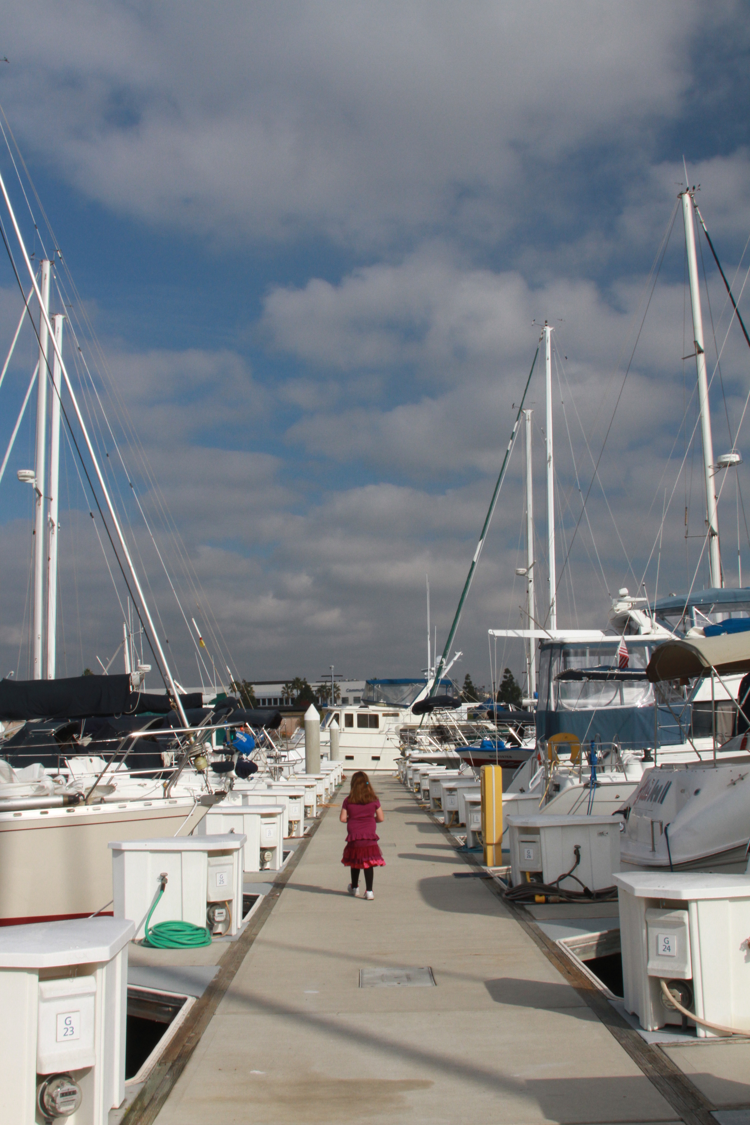 LITTLE GIRL WALKING THE DOCK SAN DIEGO BAY
