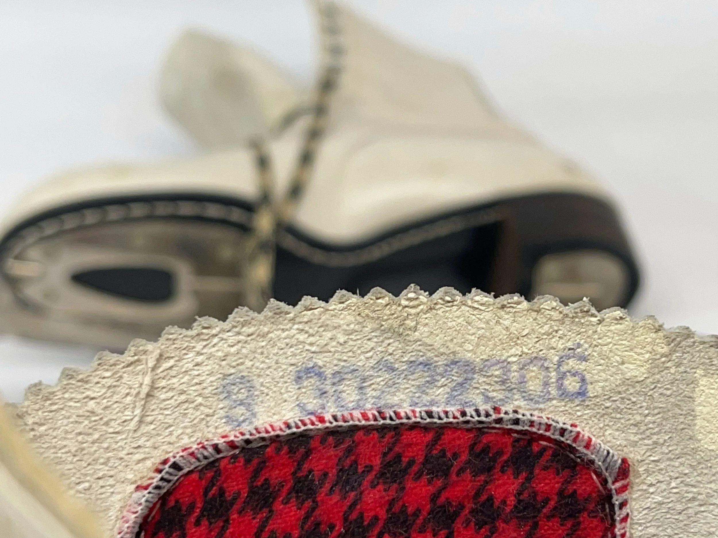 Vintage Sears ladies ice skates, white with black and red buffalo plaid interior and houndstooth shoelaces, perfect winter cabin or ski lodge decor