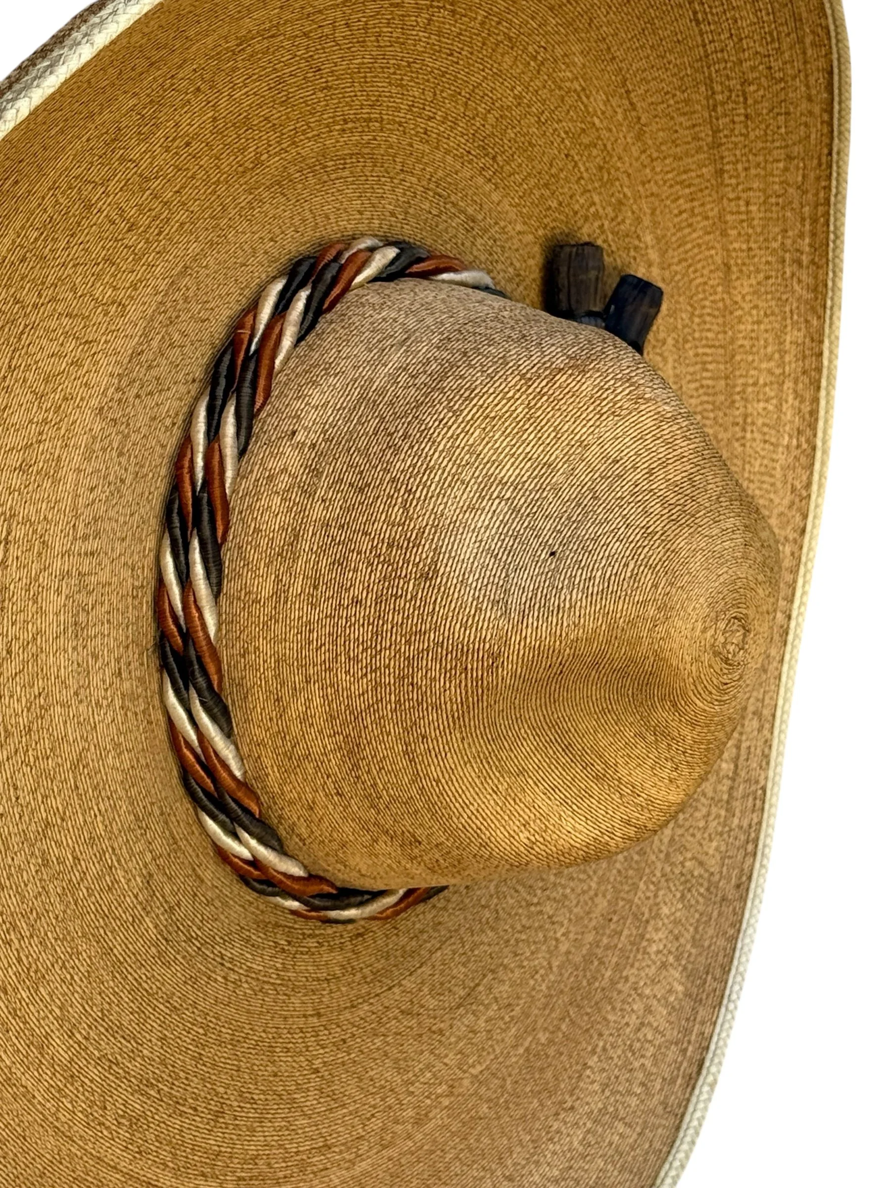 Close up detailed view of a traditional Mexican broad-brimmed hat with a high, pointed crown and an upturned brim
