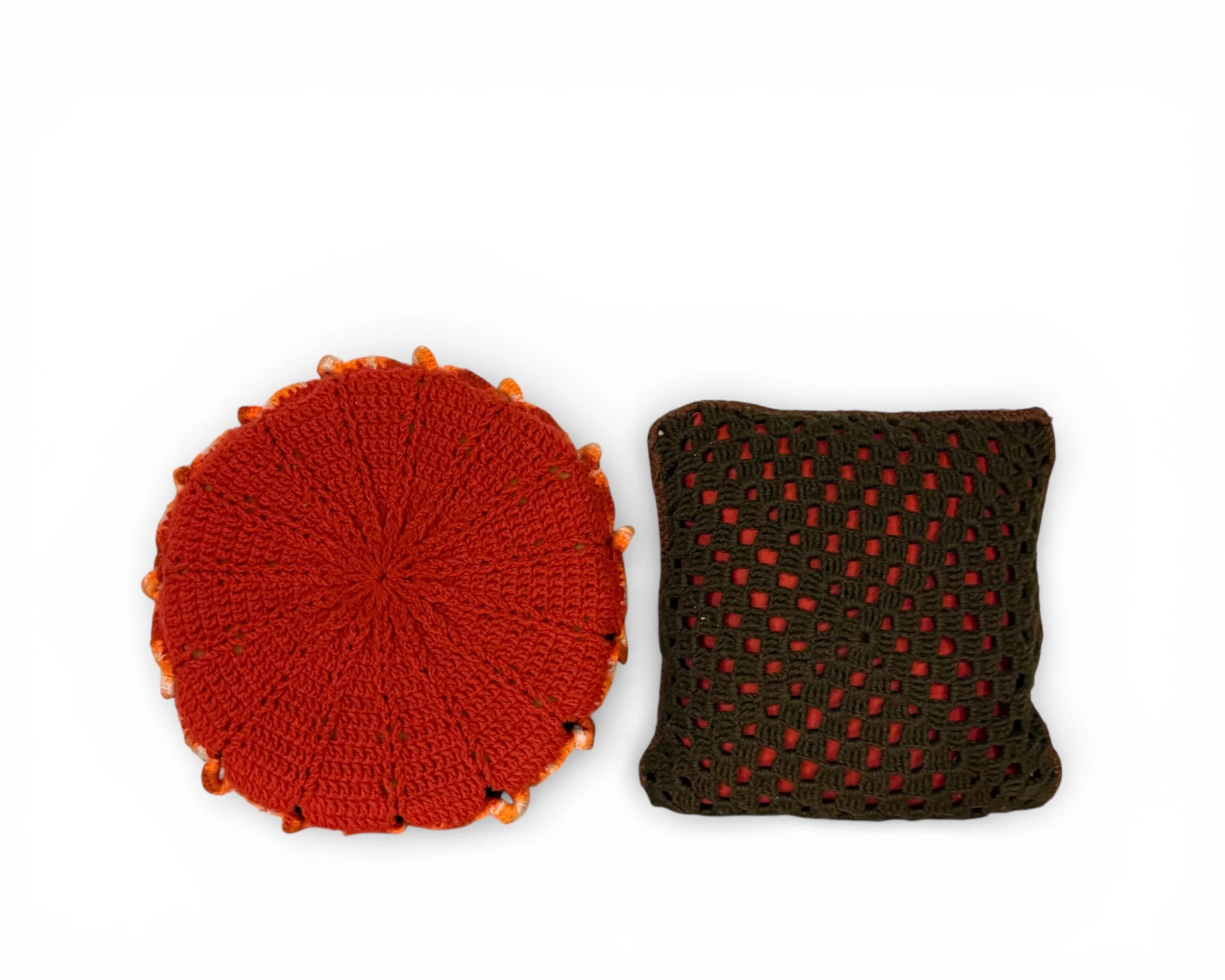 backside of vintage handmade red circle and brown square crochet accent throw pillows