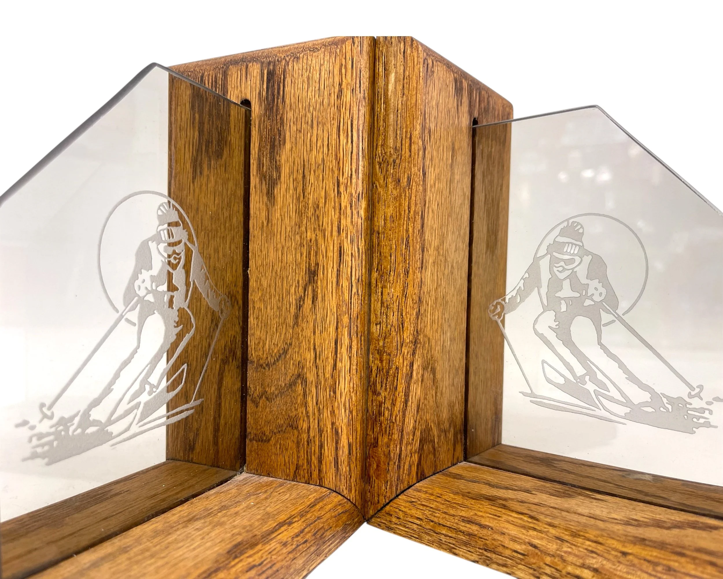 Close up of etched glass downhill skier on vintage bookend