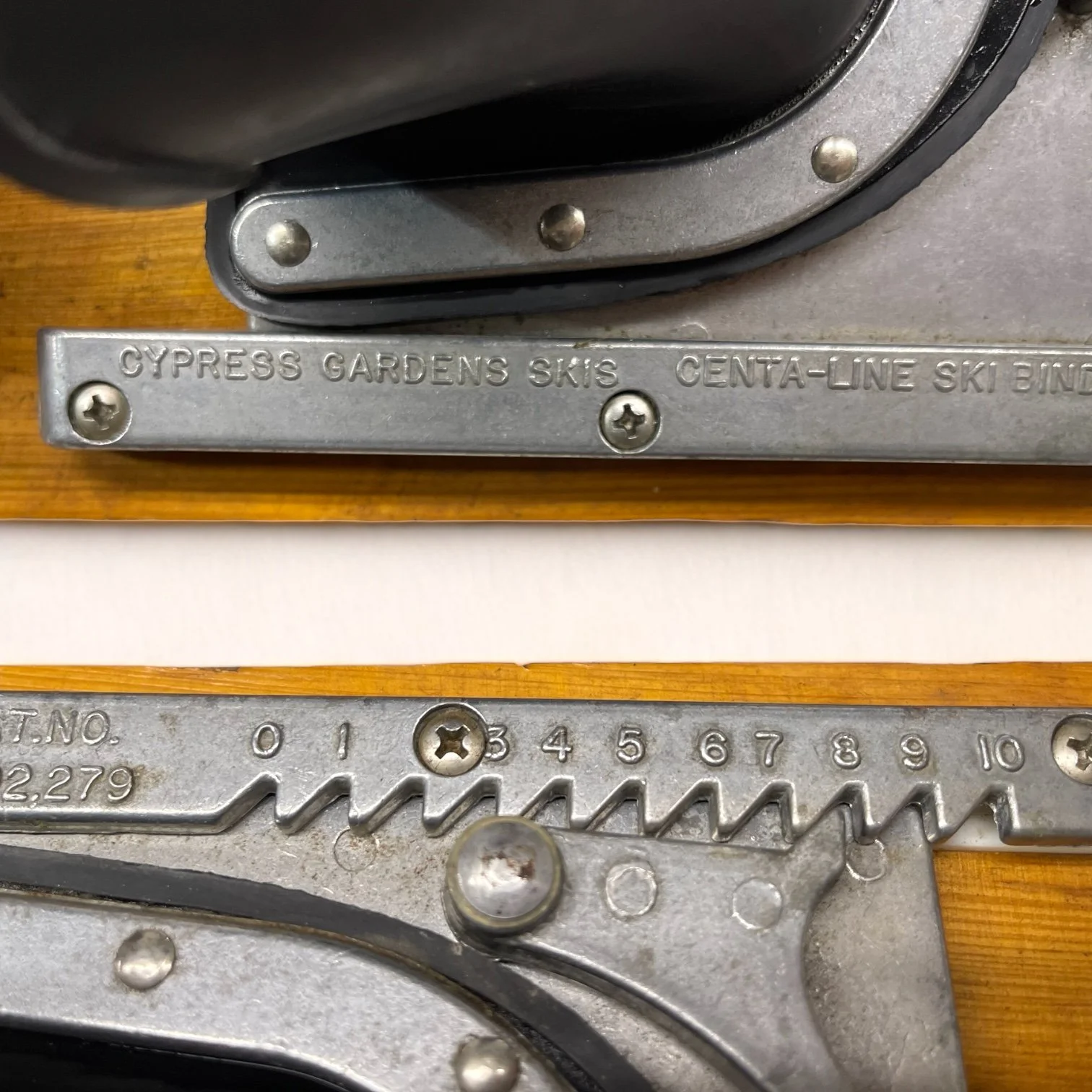 Vintage pair of Cypress Gardens trick wooden water skis, 19 3/4 inches with bindings.