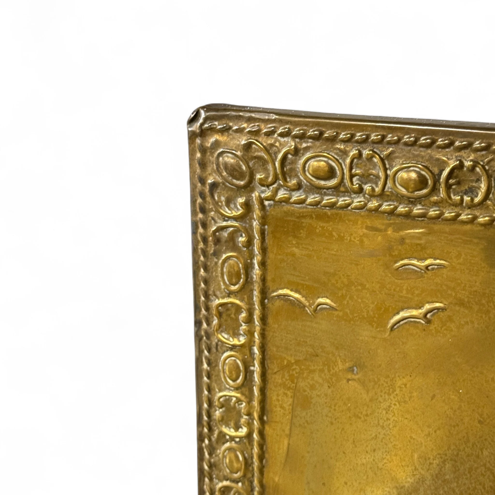 Vintage brass fireplace screen with handle with embossed Galleon ship sailing scene, mid century nautical home decor accent.