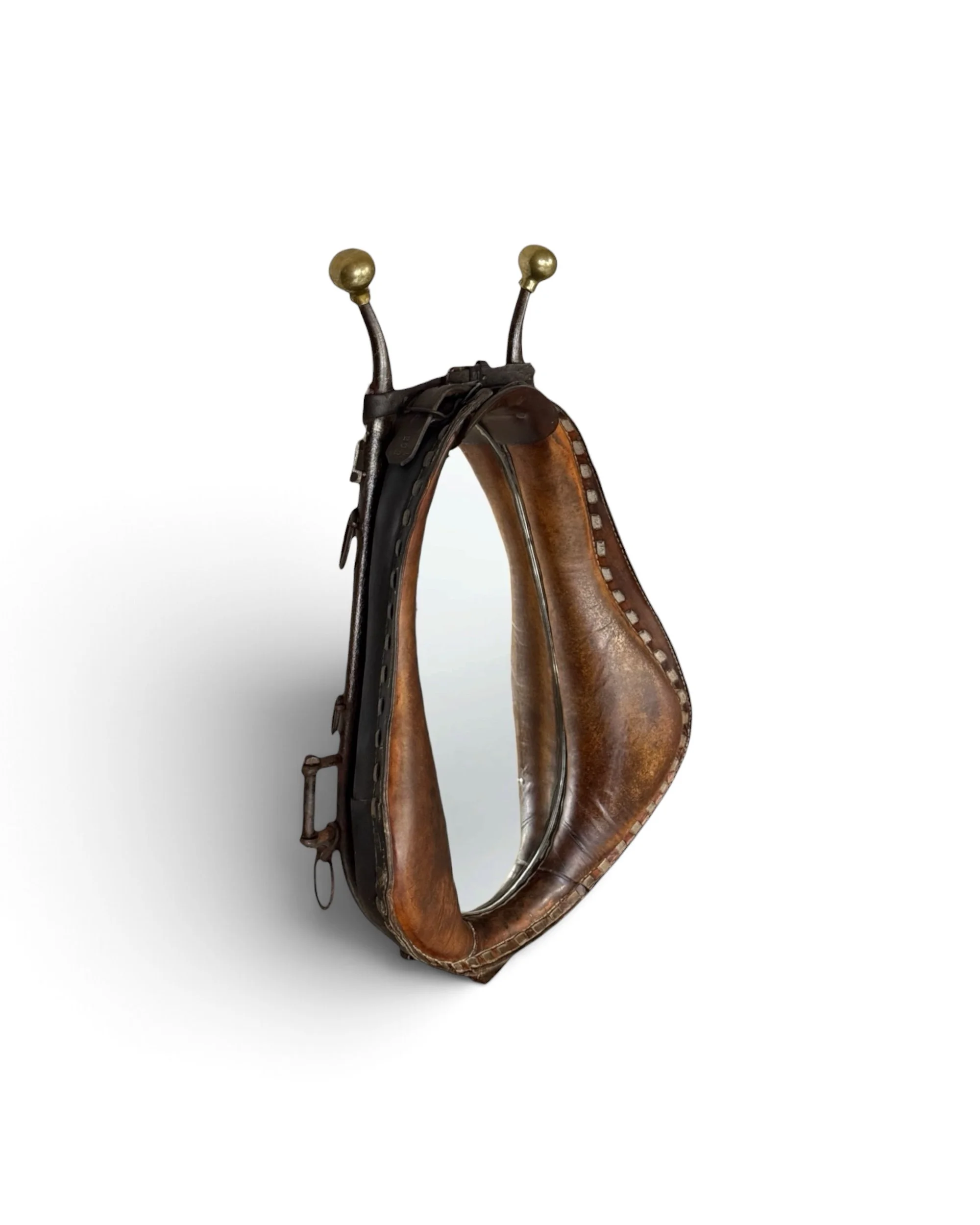 Vintage horse collar mirror made from aged brown leather with dark metal hames & brass hardware.