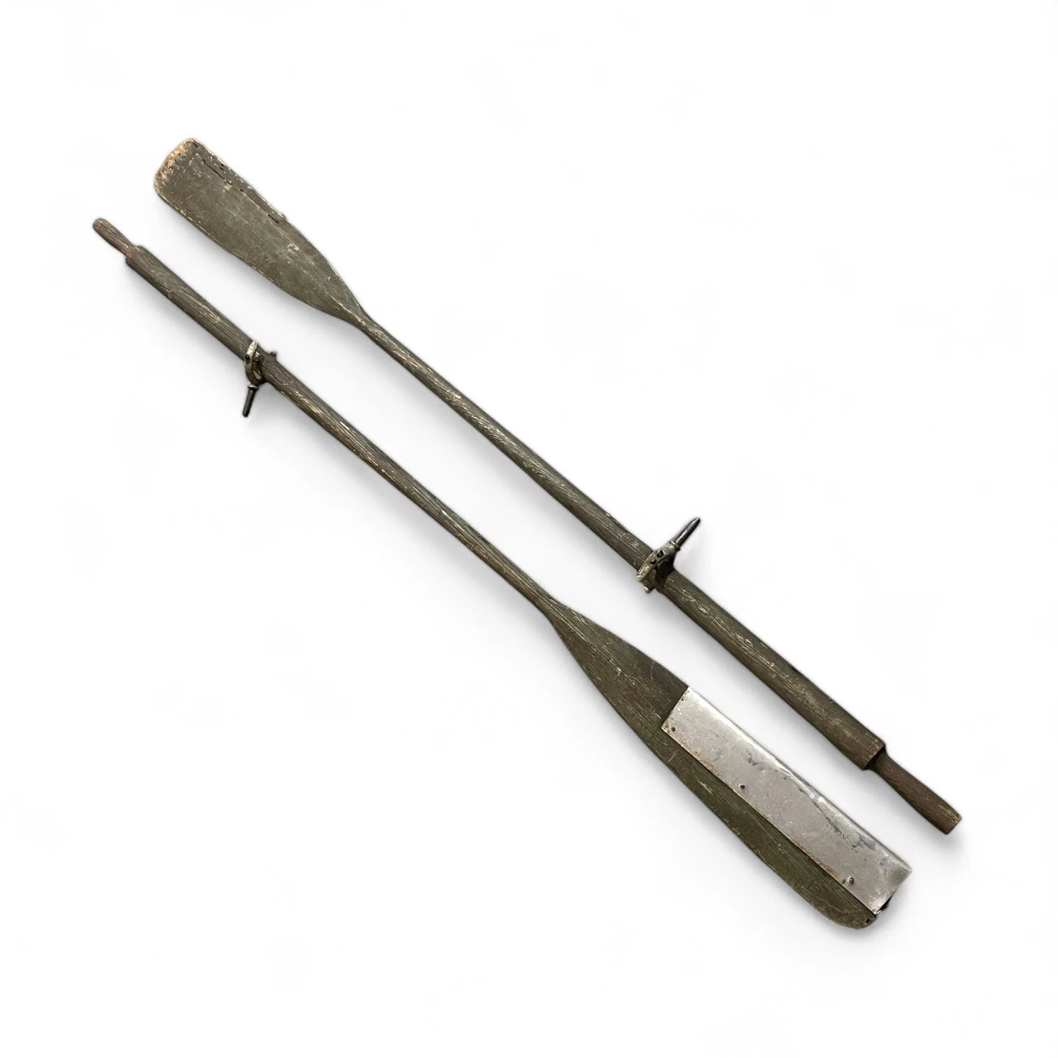 Pair of vintage wooden green boat oars with metal and oar locks.