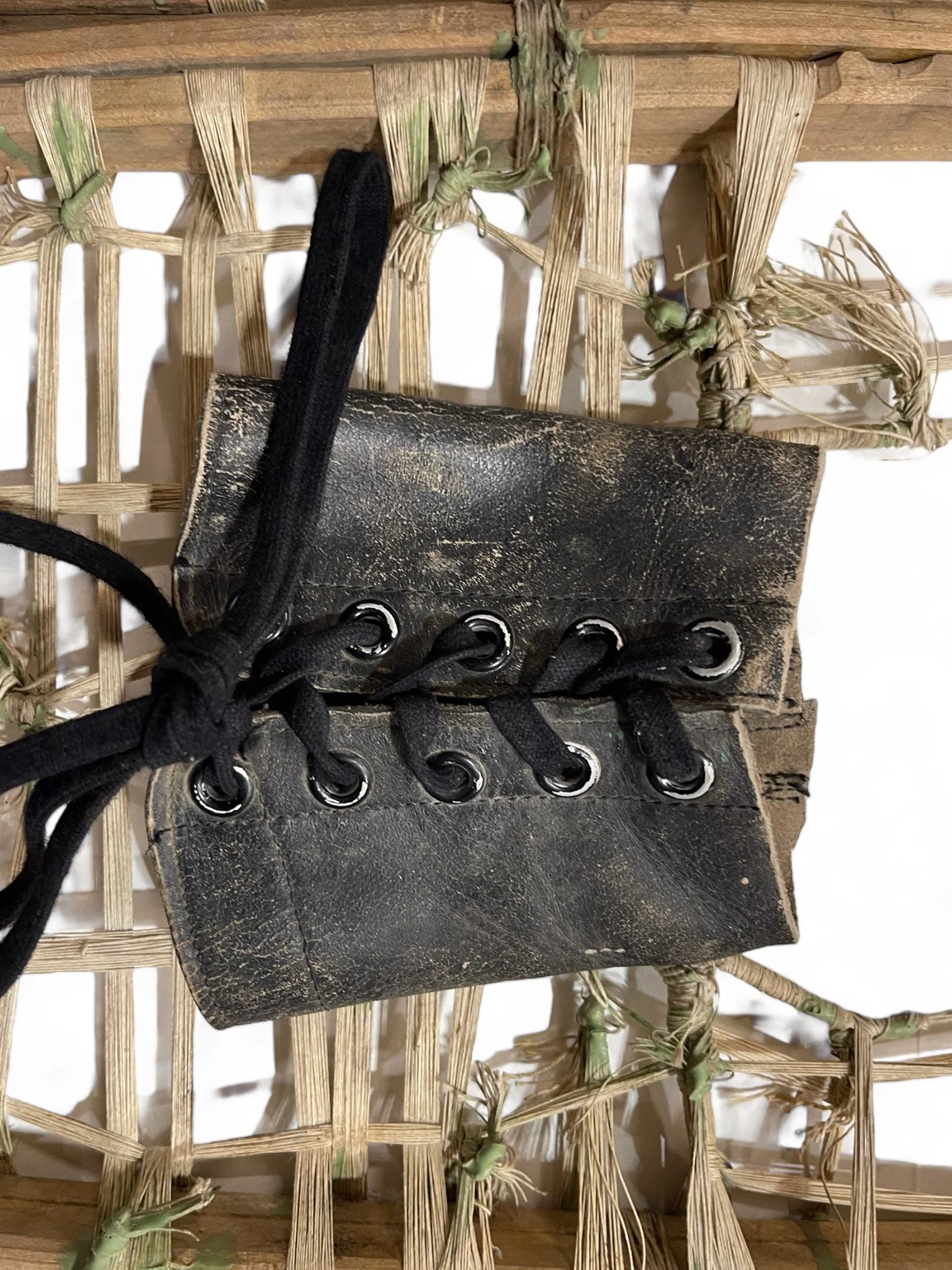 Rare and unique handcrafted vintage wooden snowshoes, featuring square toe frame, string, leather bindings.