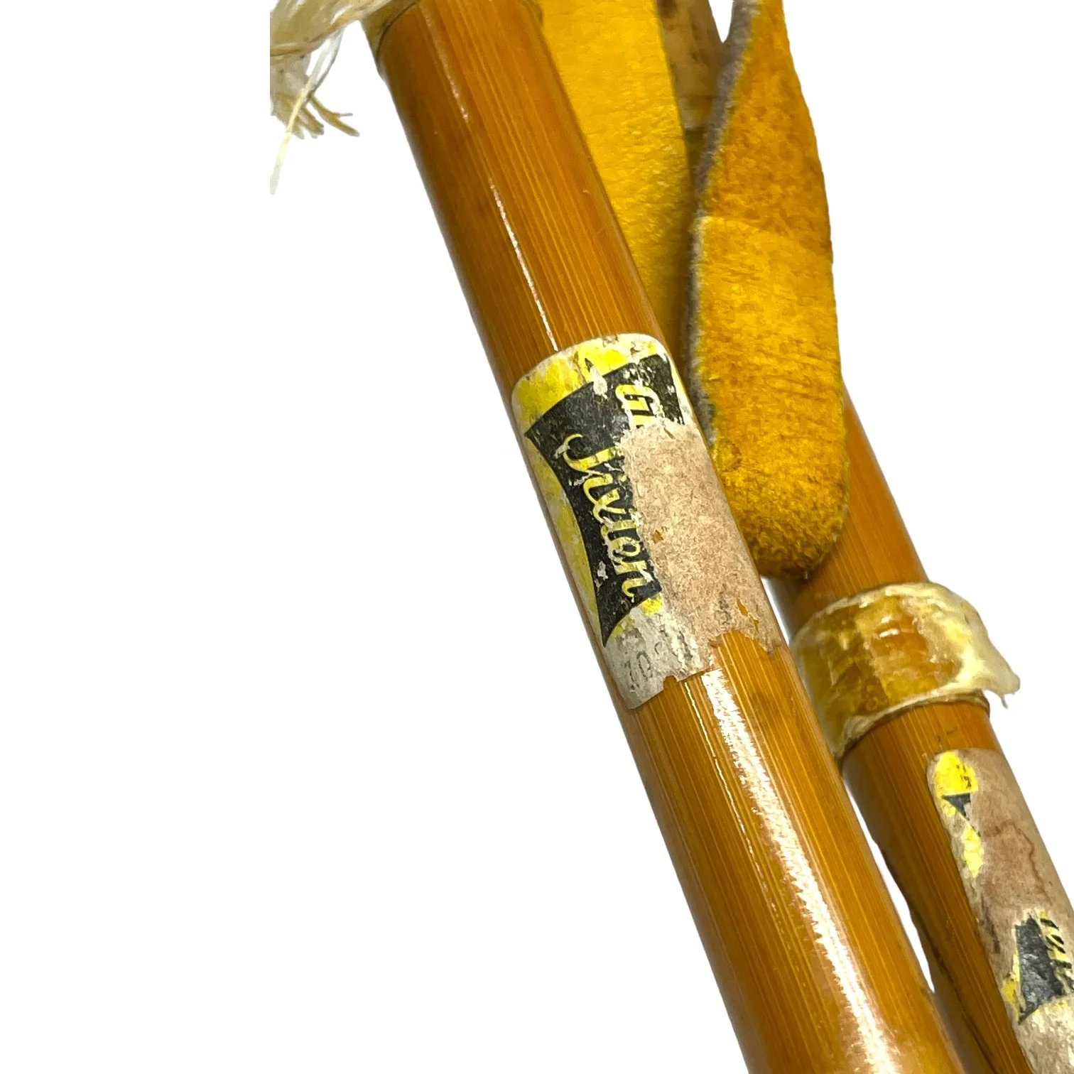 Pair of vintage wooden snowshoes with ski poles made of bamboo and cork - classic rustic winter gear perfect for cabin decor, lodge style, or outdoor adventures.