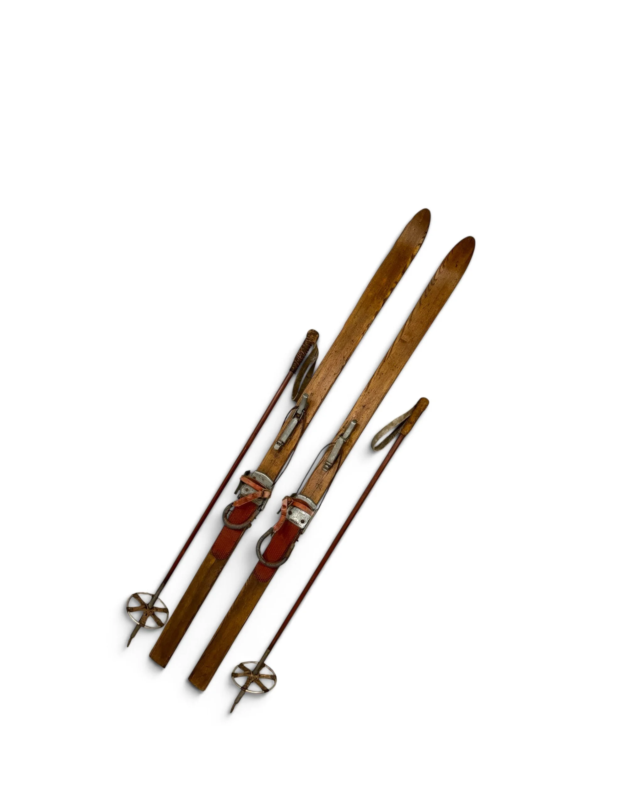 Vintage wooden snow skis with matching ski poles display for rustic cabin decor