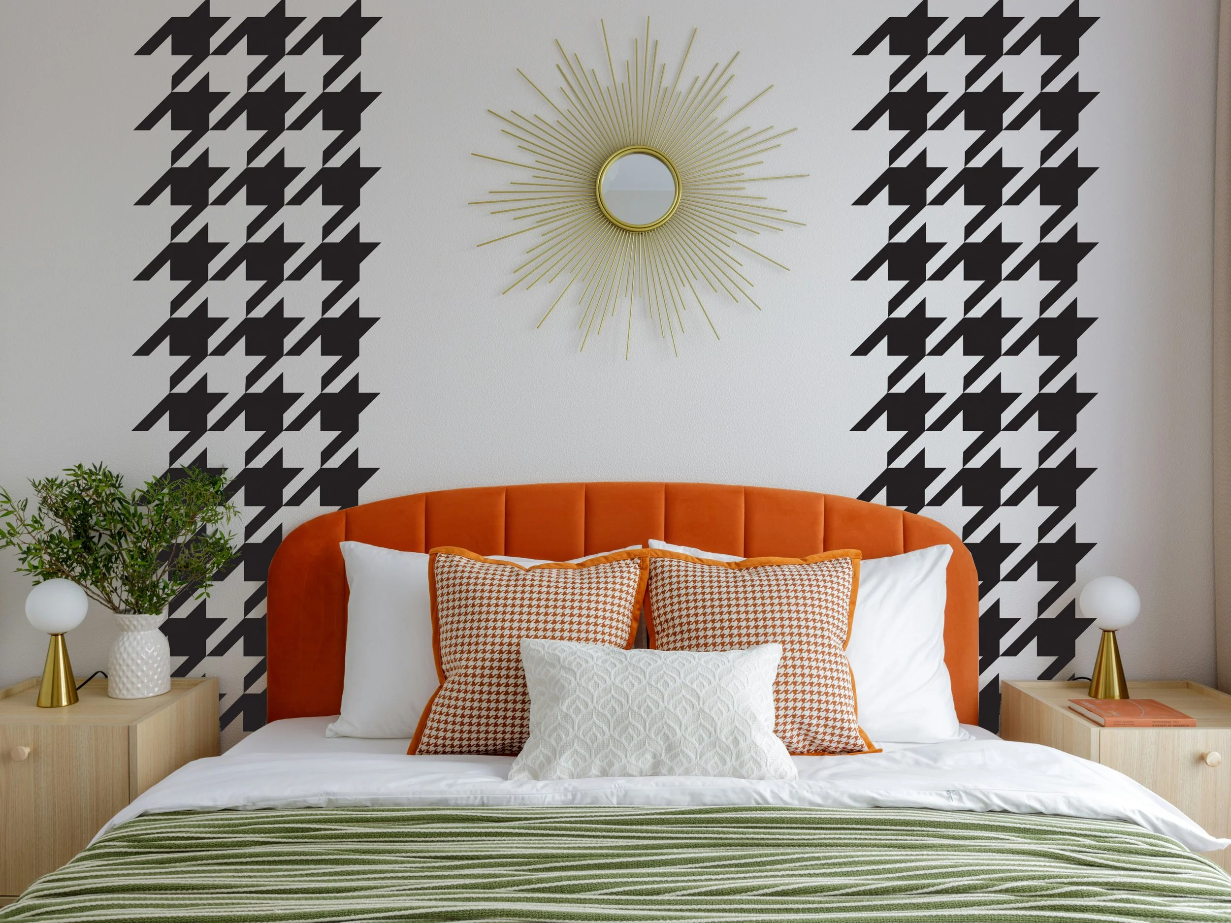 removable houndstooth pattern vinyl wall decal shown in black above the headboard of a bed