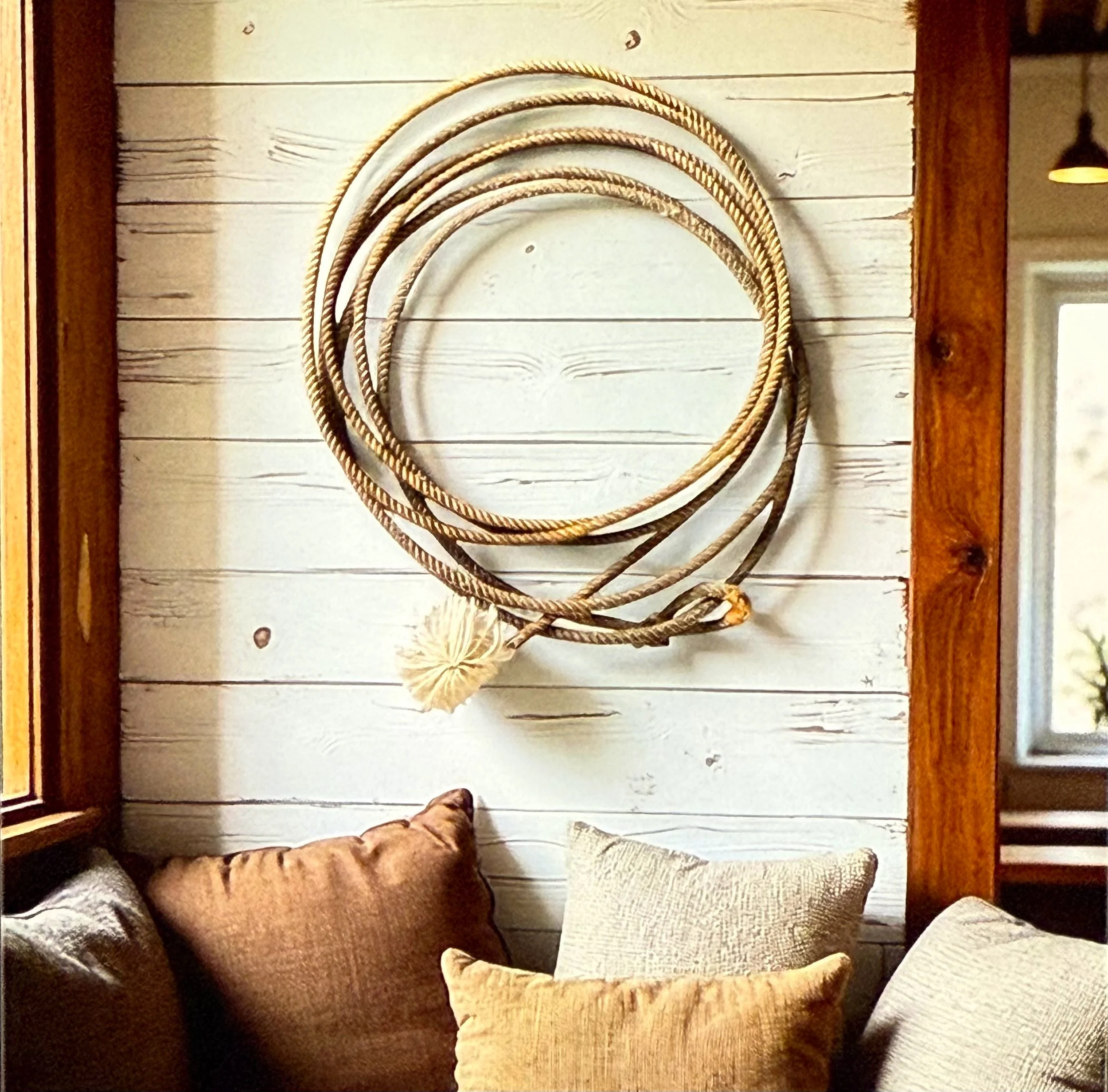 Rodeo cowboy collectible lasso rope on wood background