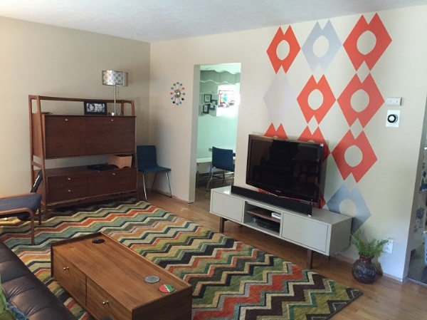 A fun room refresh full of pattern and color. Featured here, our geometric wall decals in orange and metallic silver. . Photo credit: Nadene Heckelman