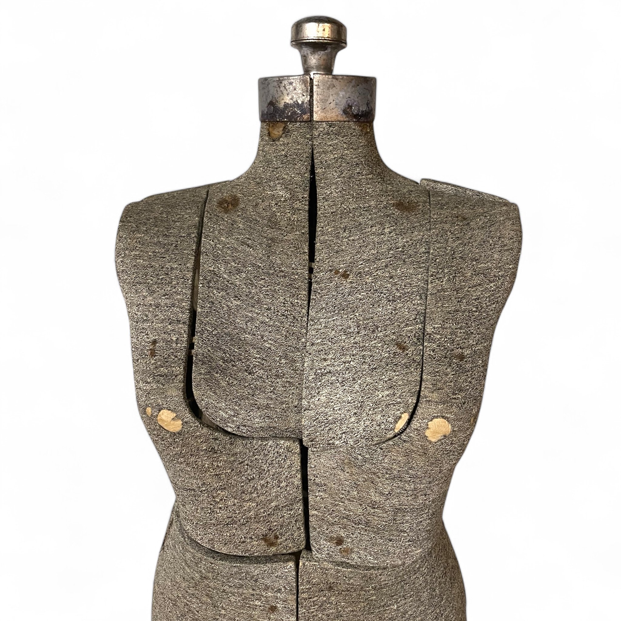 Vintage ladies adjustable dress form on a sturdy metal stand, perfect for tailoring, sewing, or as decorative piece in a fashion studio or home.
