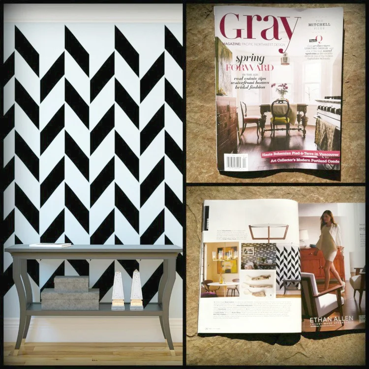 Herringbone pattern wall decal shown in black on a white wall of a modern entryway as seen in Gray Magazine.