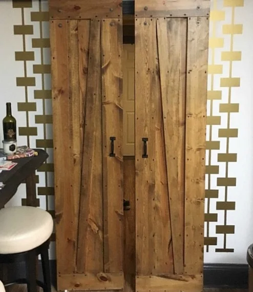 Love the way our geometric wall decals dress up the wall around these sliding barn doors. Shown here in metallic gold. Photo courtesy of Matthew Grant.
