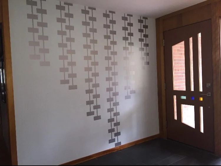A geometric wall decal featuring a rectangle pattern connected together by lines. Perfect for a modern inspired space.