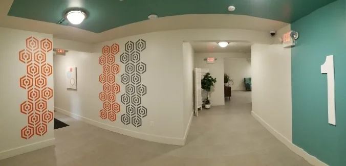 REVISEDHexagon - fragmented 1st Floor Elevator Lobby - Inglese Architecture + Engineering (orange & dark grey).jpg