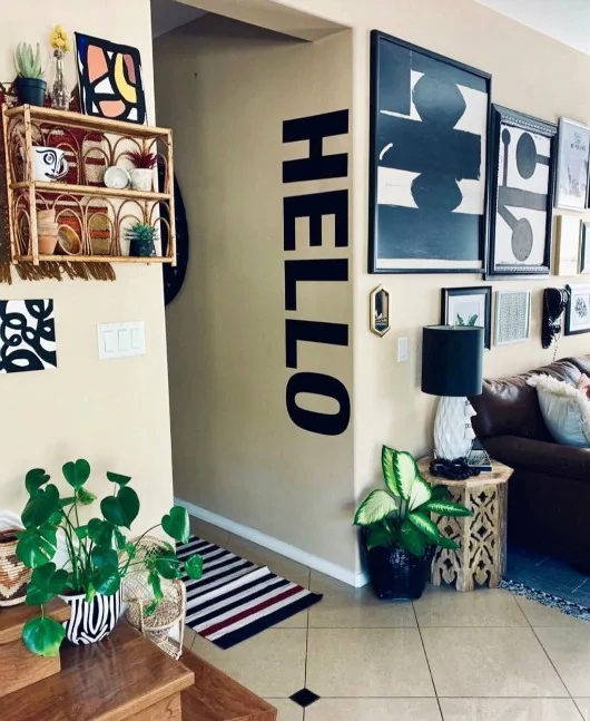 We love how our HELLO wall decal ties in with this gallery wall. Photo credit: Jamie Skolnik