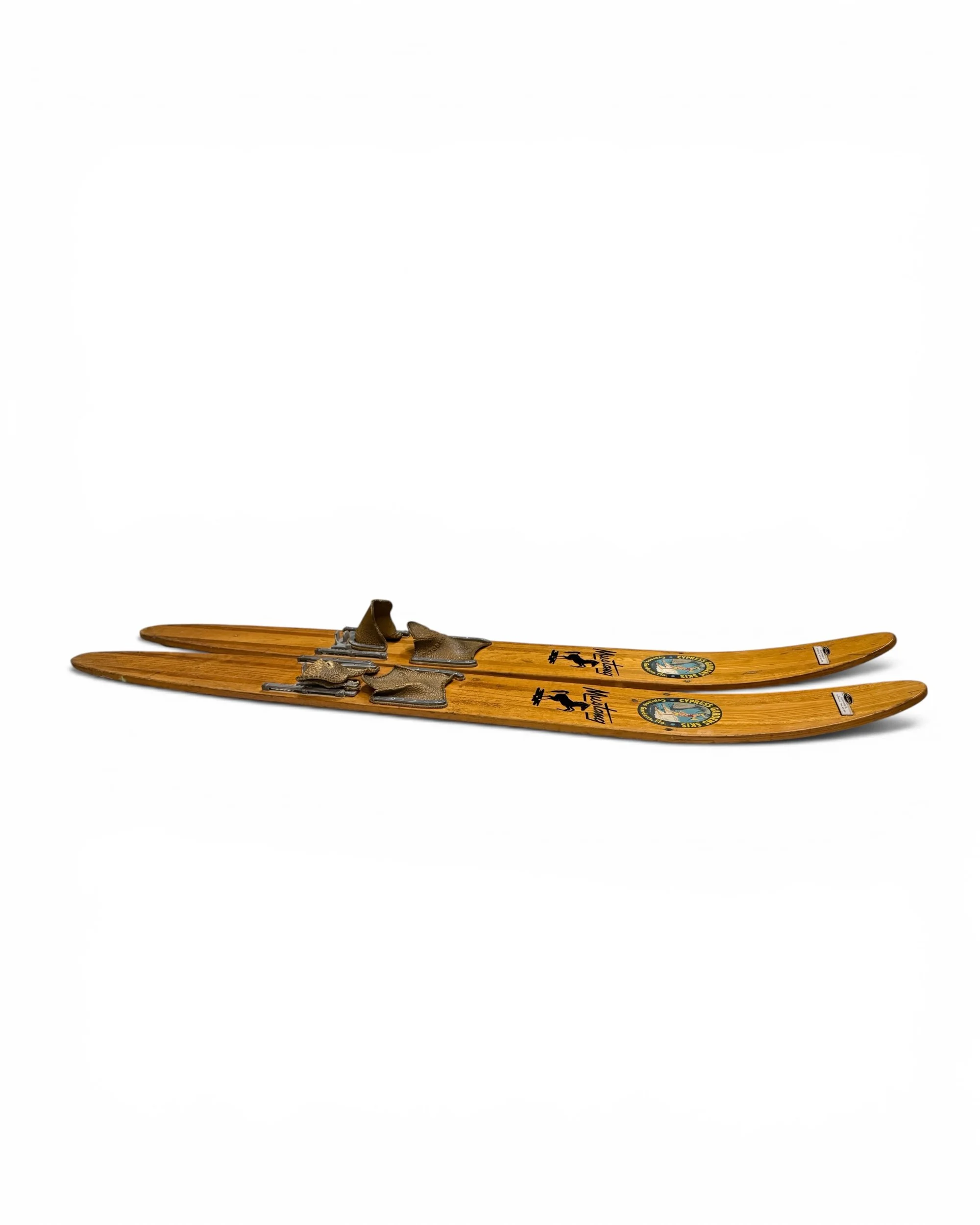 side view of pair vintage wooden water skis by Cypress Gardens