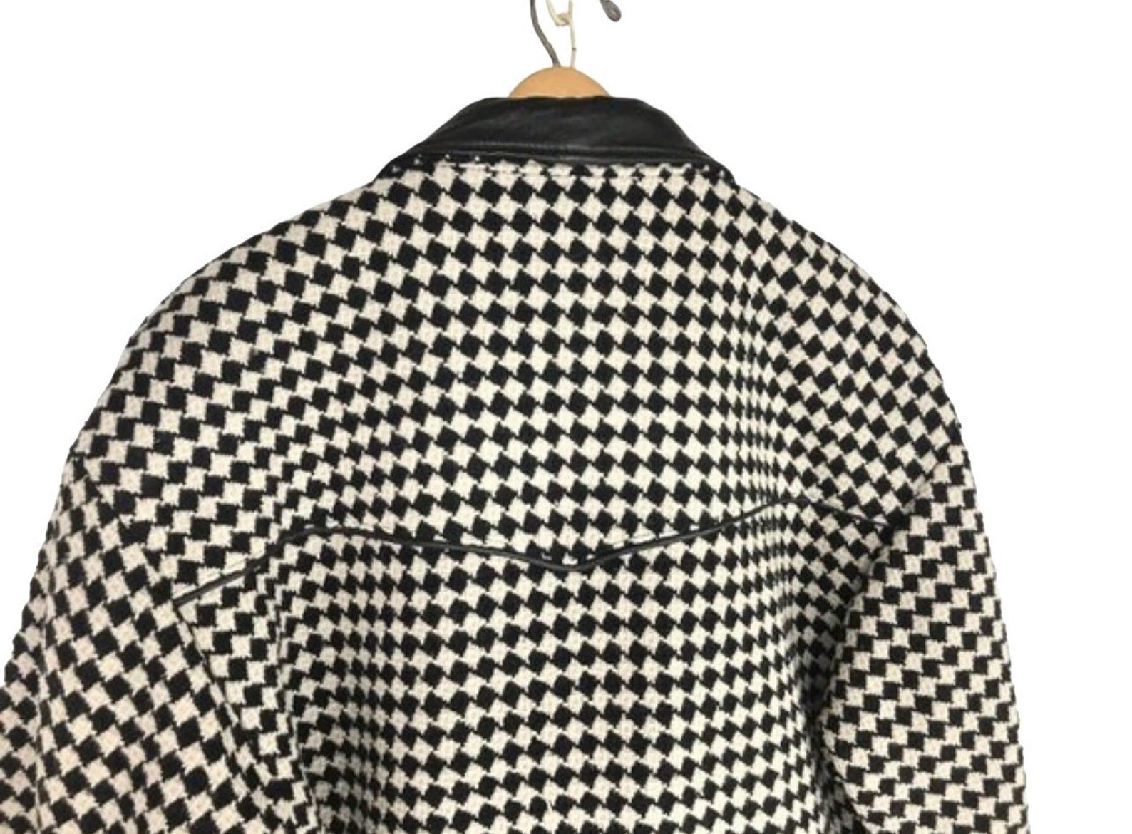 Vintage Pioneer Wear womens size medium black and white houndstooth coat, fully lined, trimmed in black leather, button front closure, two side pockets.