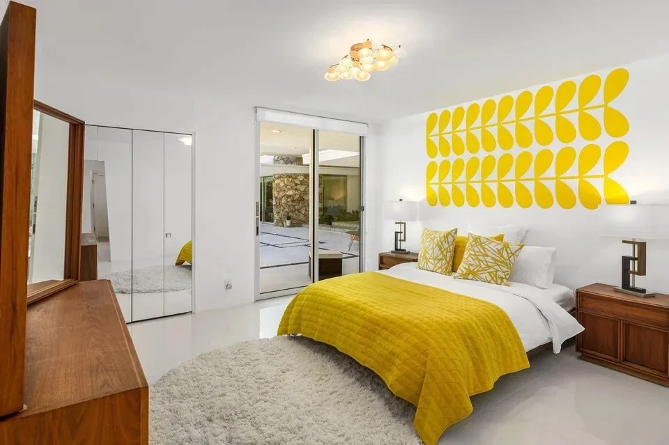 Retro floral wall decals by Wall Star Graphics in a mid century inspired primary bedroom in Palm Springs, CA.