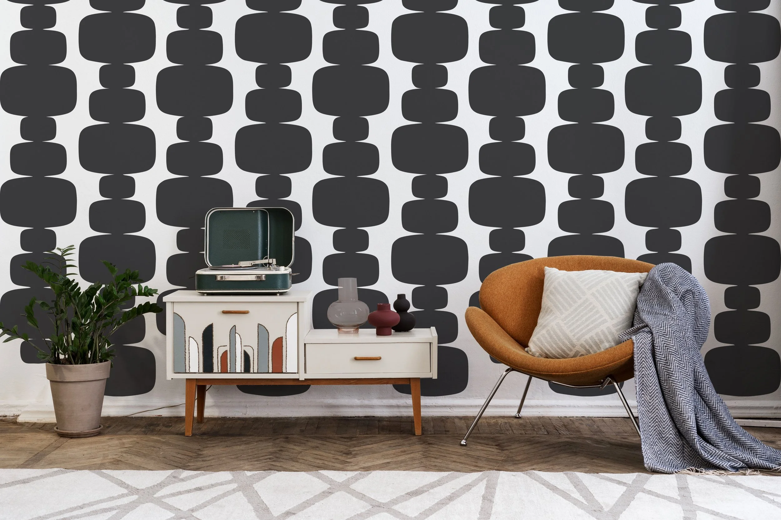 Bold and stylish geometric pattern vinyl wall decals byWall Star Graphics shown in black on a whitewall of a retro room.