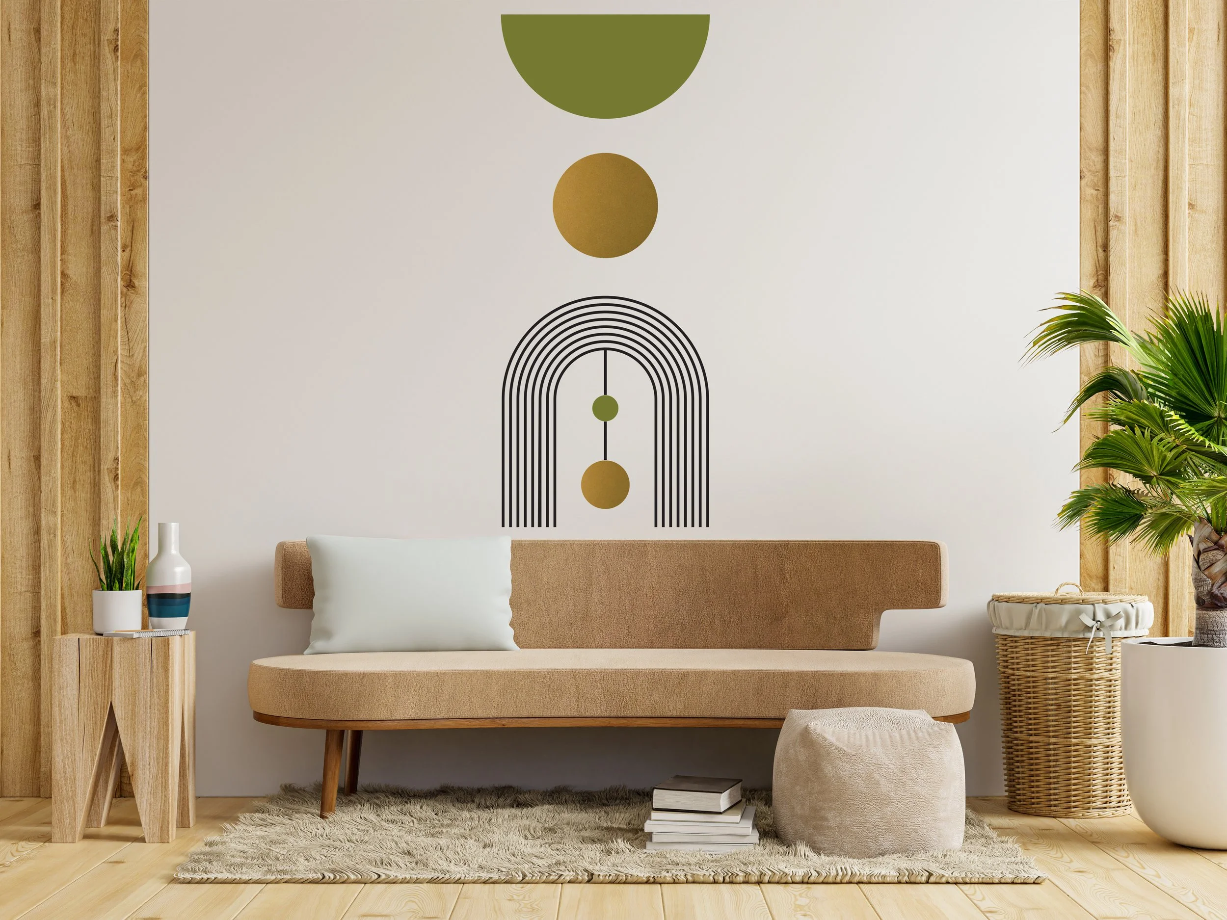A set of geometric boho chic style wall decals in olive, black, and metallic gold including half circles, circles, and stripe arch by Wall Star Graphics, on a white wall behind a mid century couch.