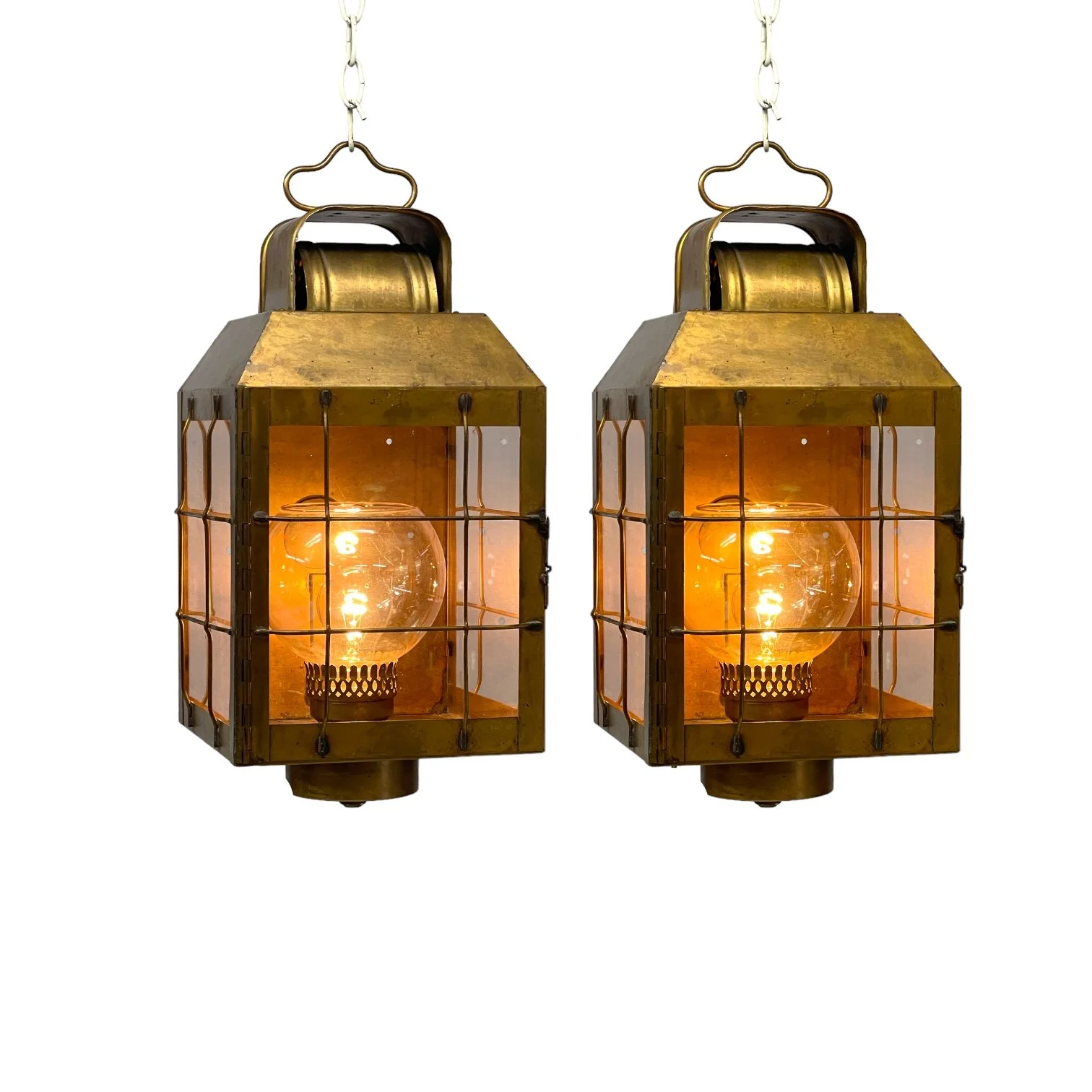 Vintage pair of hard wired brass nautical lantern lights suitable for indoor/outdoor use, made by Hollywood Lighting Fixture Co.