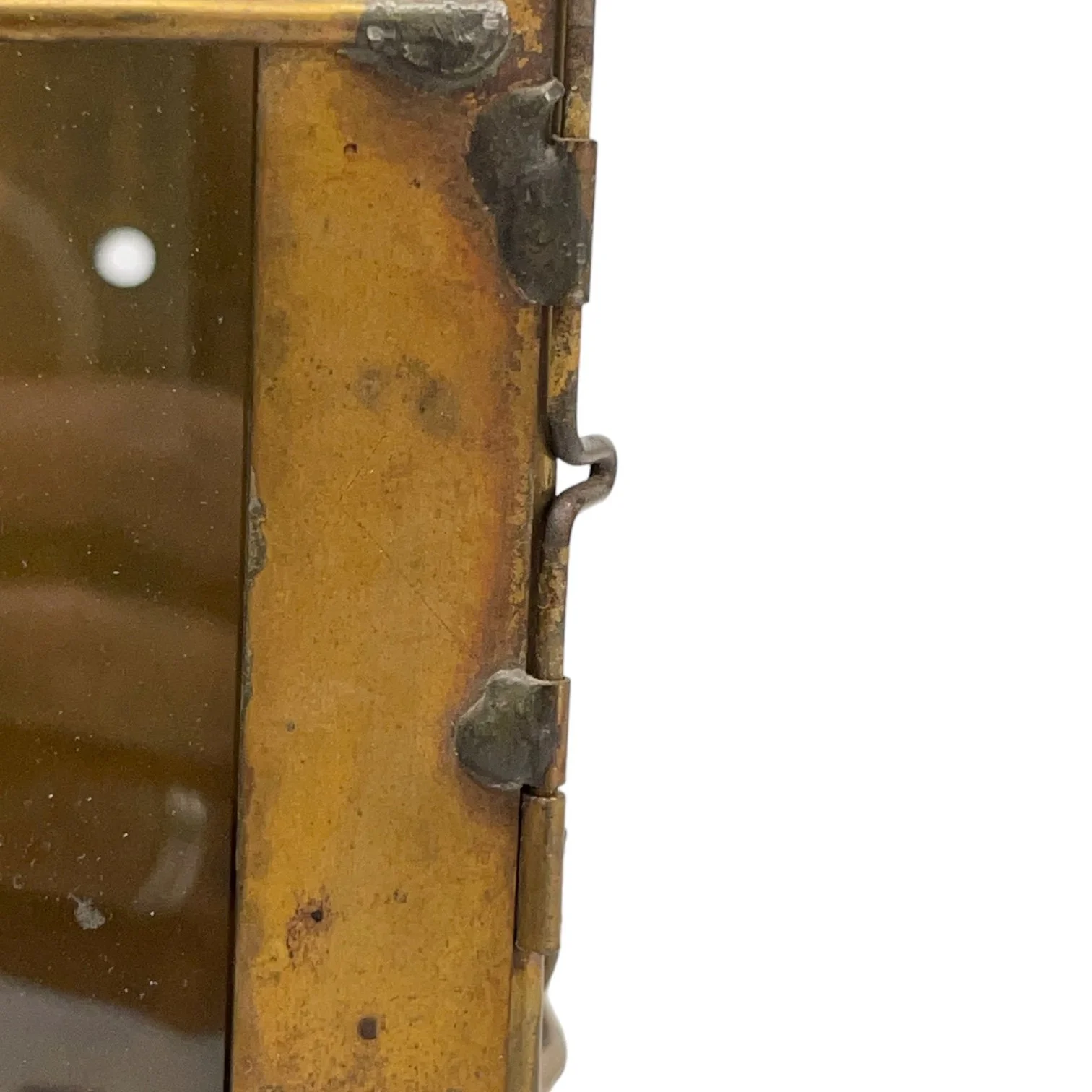 Side view of a brass and glass door on a vintage pair of hard wired brass nautical lantern lights suitable for indoor/outdoor use, made by Hollywood Lighting Fixture Co.