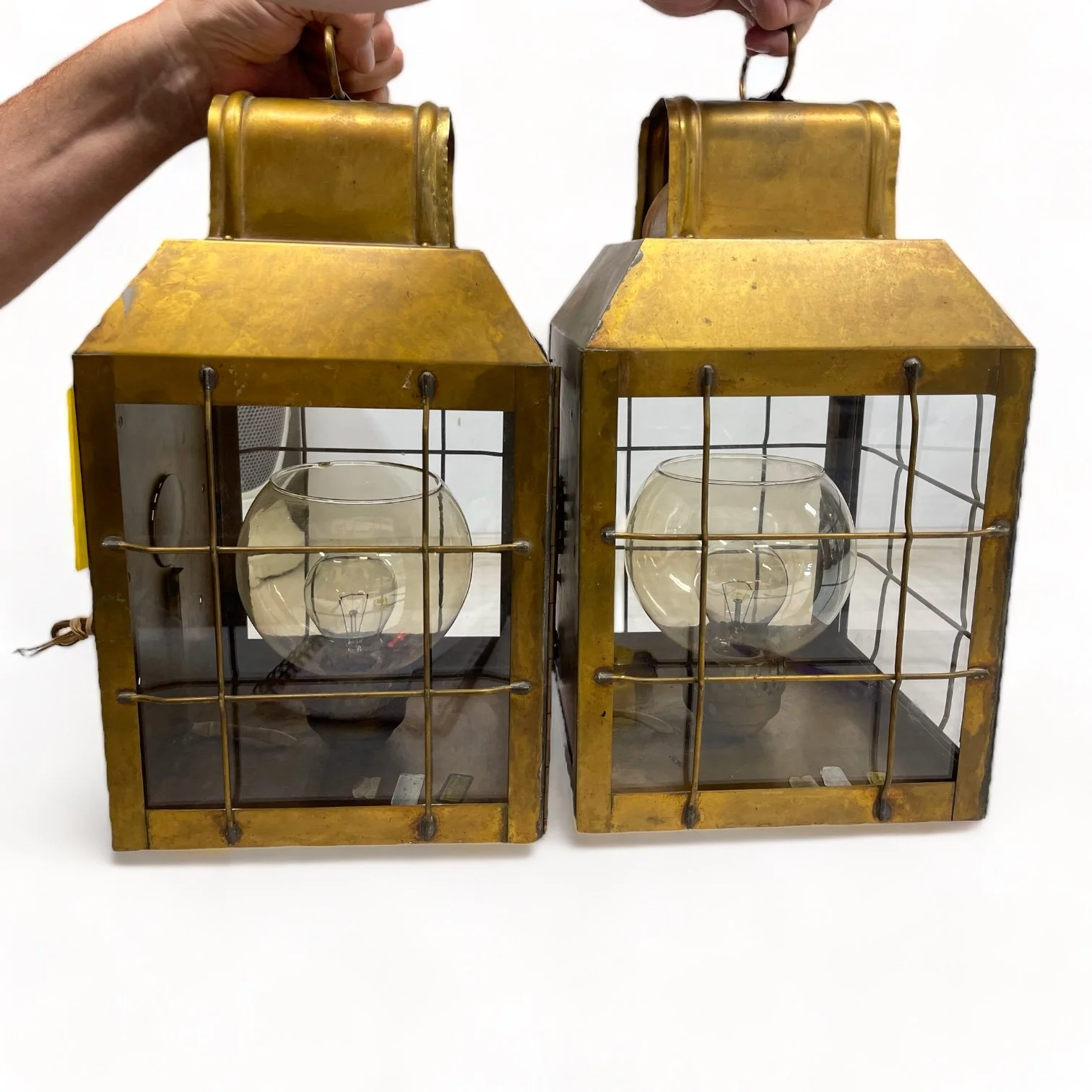 Vintage pair of hard wired brass nautical lantern lights suitable for indoor/outdoor use, made by Hollywood Lighting Fixture Co.