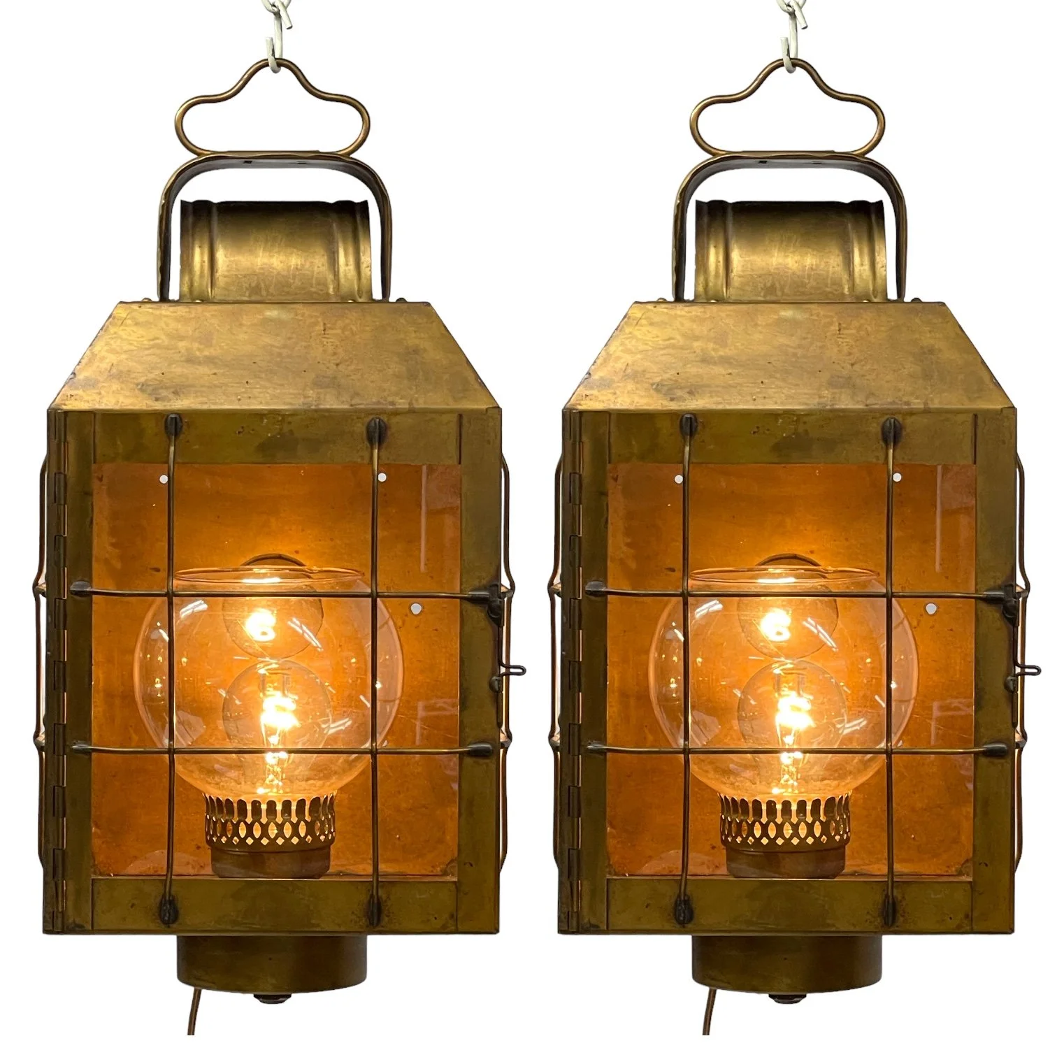 Vintage pair of hard wired brass nautical lantern lights suitable for indoor/outdoor use, made by Hollywood Lighting Fixture Co.