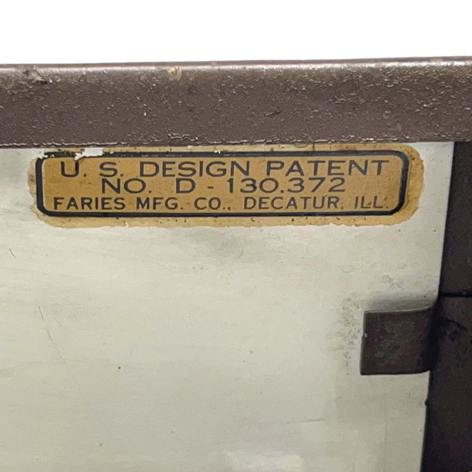 Label of a vintage Faries Art Deco Adjustable Bankers Lamp in brown with gold accents.