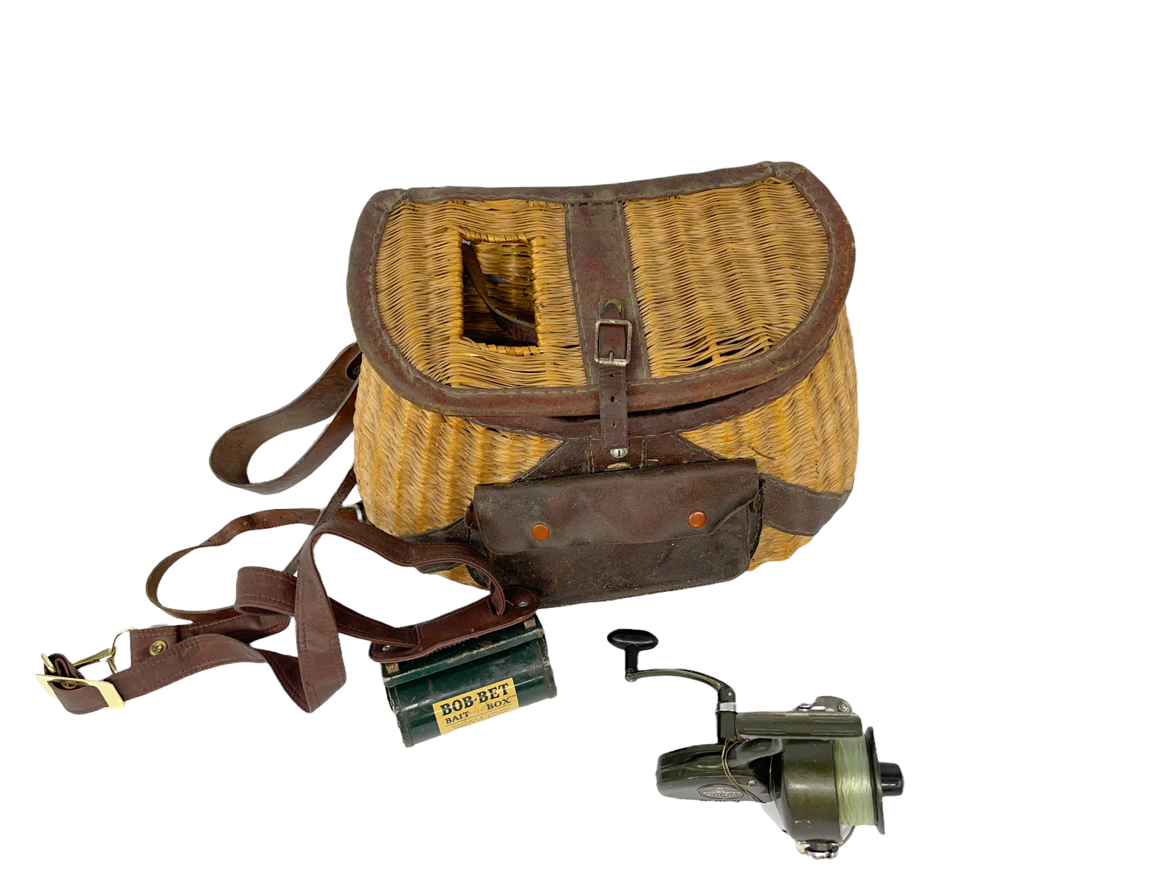 A set of vintage fishing items or gifts for anglers that consists of a Spinster Diamond Ball Bearing fishing real, a vintage fishing creel, and a vintage green metal Bob Bet Bait Box.
